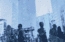 Silhouettes of professionals walking through a financial district, symbolizing career opportunities after passing the SIE Exam