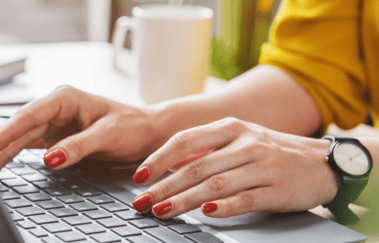 Woman studying on laptop to prepare for FINRA exam