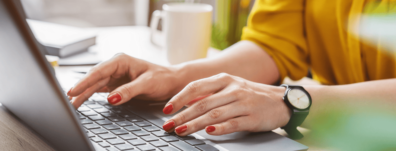 Woman studying on laptop to prepare for FINRA exam