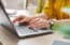 Woman studying on laptop to prepare for FINRA exam