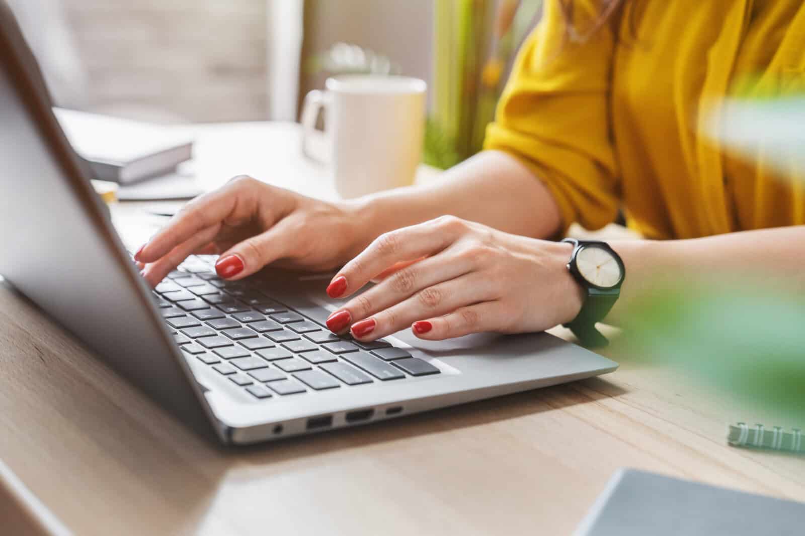 Woman studying on laptop to prepare for FINRA exam