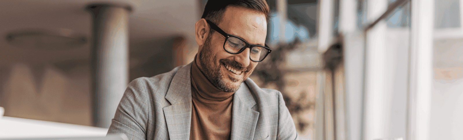 Confident financial advisor reviewing documents and smiling, representing successful securities and insurance cross-sell strategy